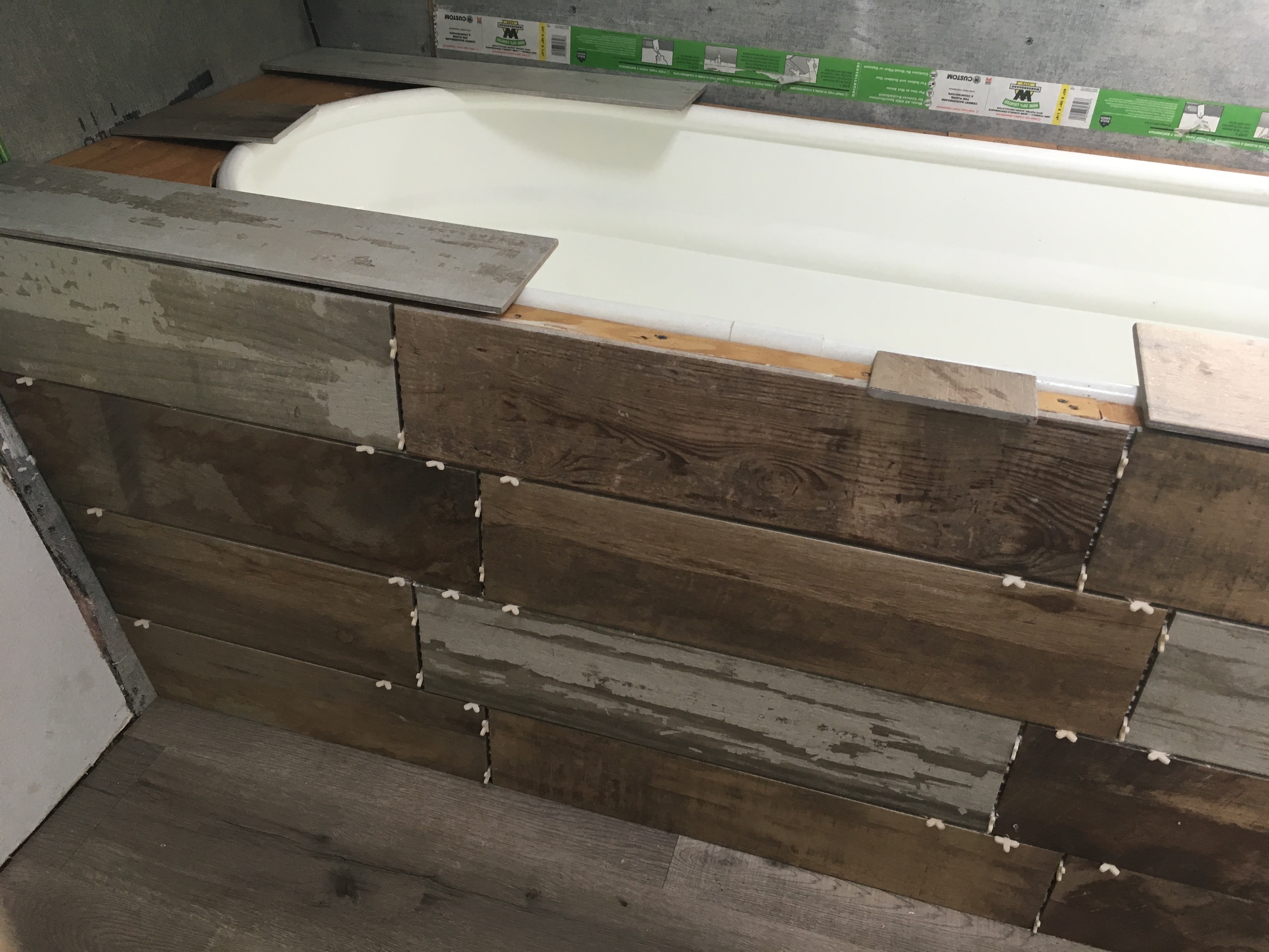 horse trough bathtub with brown tile