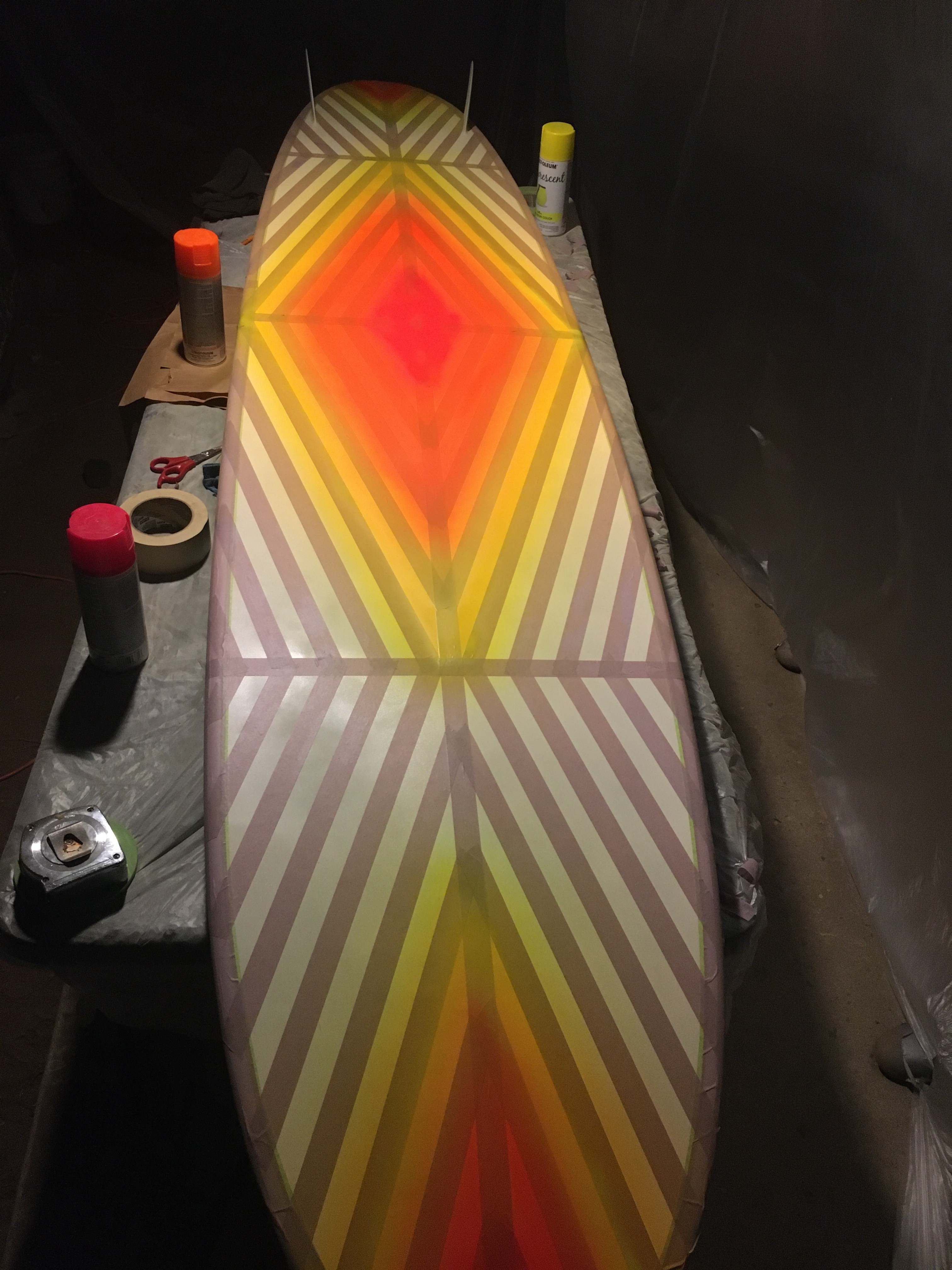 longboard surfboard painted white orange red yellow