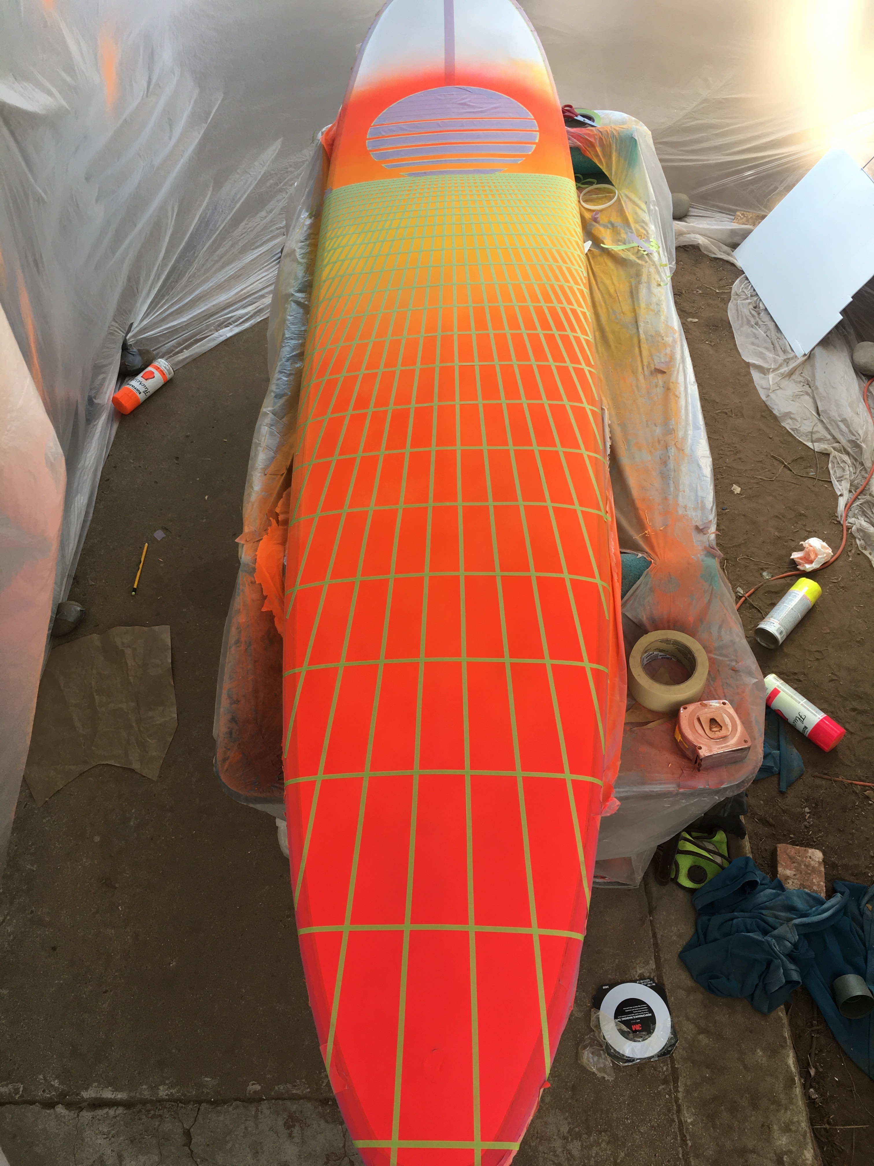 longboard surfboard painted white orange red yellow