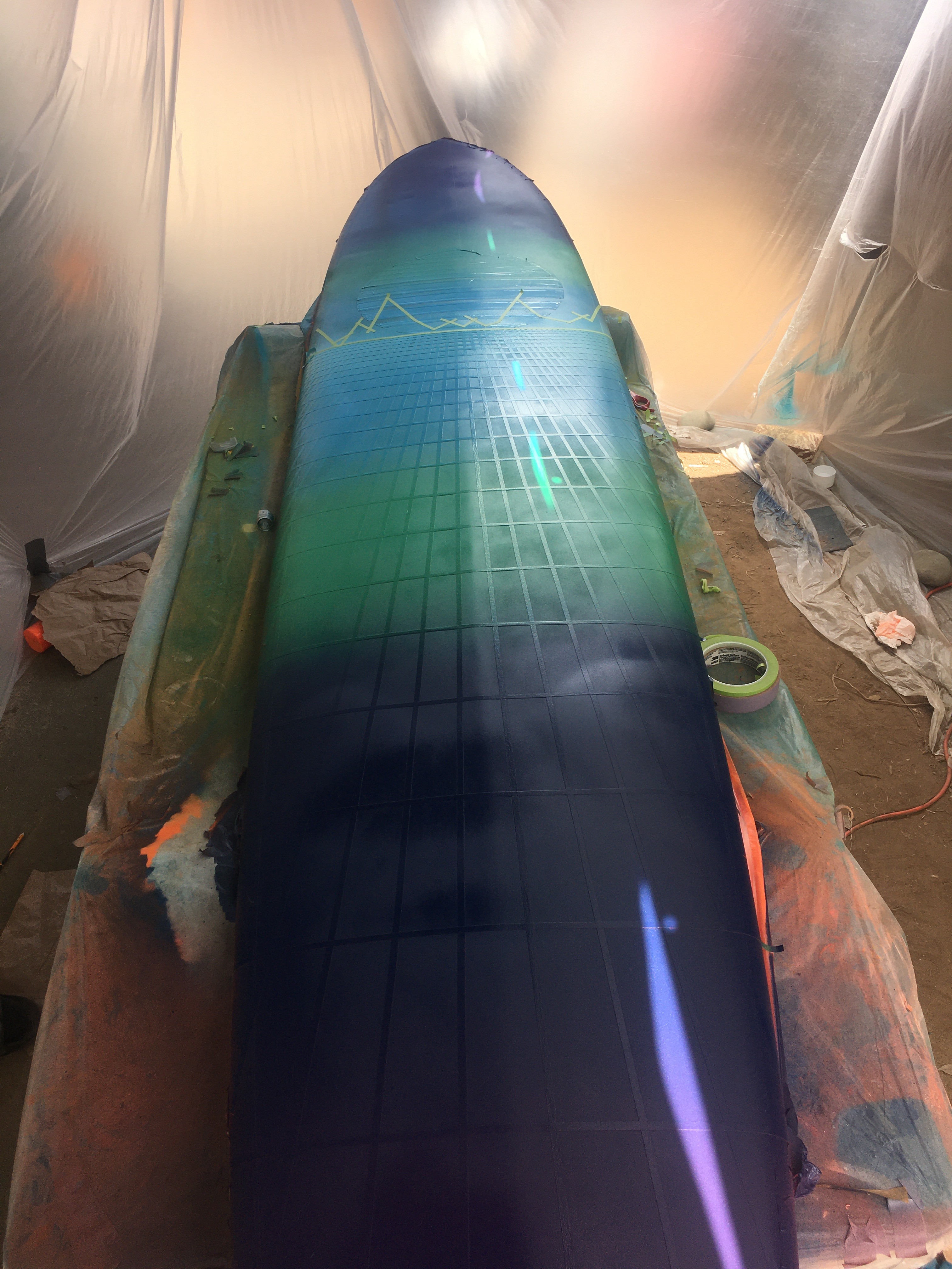 longboard surfboard painted with blue green purple